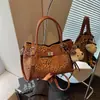Bolsas de nicho transfronteiriças super populares para mulheres 2026 nova bolsa transversal moderna bolsa de balde de mão requintada super popular