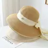 Sombrero de paja de ala ancha con elegante lazo estilo Hepburn para vacaciones de verano en la playa, protección solar y sombrero de pescador para estilizar el rostro
