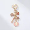 Nuevo Llavero de Lujo Ligero con Diamantes, Colgante de Aleación de Micrófono Cd de Vida Marina, Colgante para Bolso de Chica Dulce