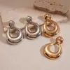 Brincos Geométricos de Metal Agulha de Prata Brincos de Tarraxa de Luxo Leve de Alta Qualidade Brincos de Moda Transfronteiriços Europeus e Americanos com Senso de Design de Nicho
