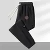 Pantalones de chándal de pana para hombre para otoño, pantalones casuales de retazos, corte holgado, pantalones jogger versátiles y modernos, pantalones largos para hombre