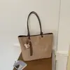 Bolso de mano de gamuza a la moda para mujer, nuevo estilo 2026, bolso tote para el trabajo, bolsa de almacenamiento, bolso de viaje portátil, bolso de axila marrón