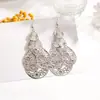 Pendientes de Metal Calado Transfronterizos de Hoja Multicapa Retro Étnicos Feng Shui Colgante de Disco Geométrico con Borlas Venta al por Mayor