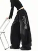Jeans Lavados Negros Degradados Desgastados Tipo Cimitarra para Hombres y Mujeres Ropa de Calle Retro Sueltos de Pierna Ancha Pantalones de Jazz con Letras