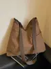 Bolso de hombro de estilo coreano simple retro de nicho transfronterizo 2026, bolso de mano casual de color sólido de gran capacidad