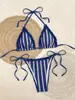 Nuevo traje de baño de comercio exterior, un conjunto de bikini popular para ventas transfronterizas en Amazon, con un elegante diseño a rayas, perfecto para la playa y disponible en stock.
