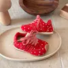 Zapatillas de entrenamiento para niños 2026 primavera y otoño nuevas versión coreana para niñas con lunares Zapatos Forrest Gump suela blanda zapatos deportivos para correr