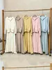 Conjunto de estilo coreano, un conjunto completo de las nuevas llegadas de otoño e invierno 2026, conjunto de dos piezas para mujer con suéter con capucha y cremallera y falda de punto de cintura alta