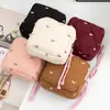 Bolsa de almacenamiento acolchada con forma de lazo para toallas sanitarias, neceser de viaje portátil, bolsa multifuncional para labiales y maquillaje