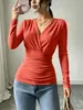 Nueva moda femenina transfronteriza europea y americana, camiseta de manga larga estilo francés con cuello en V cruzado, cintura fruncida ceñida, ajuste ceñido y adelgazante, top de otoño-invierno