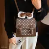 2026 Mochila Versátil Estilo Coreano com Bolinhas Moda Outono Nicho Nova Mochila Universitária Feminina com Laço Diário