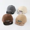 Al por mayor Otoño 2026 Lana Cálida Gorra de Pato para Bebé Estilo Coreano Serie a Cuadros para Niños y Niñas Sombrero de Ala Suave de Moda para Bebé