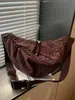 Bolso vintage de nicho con estampado de leopardo para otoño e invierno para mujer 2025 nuevo casual versátil marrón moderno para el trabajo bandolera tipo albóndiga