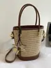 Bolso Cubo Tejido de Paja Estilo Vacacional para Mujer 2026 Nuevo Verano Moda Tejido Nicho Hombro Único de Mano Cruzado