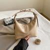 Bolso pequeño dulce portátil francés 2024 Otoño Nueva moda Estilo occidental Simple Hombro Axila Media luna