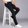 Pantalones de moda juveniles ajustados, pantalones para hombre estilo Harajuku nuevo, pantalones casuales, pantalones negros de vestir de rendimiento
