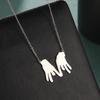 Europa y los Estados Unidos exageraron la personalidad al por mayor de joyería de acero de titanio corte hueco ocho dedos dos manos colgante 304 collar de acero inoxidable