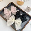 Clip de resorte con lazo de perla, accesorio para el cabello de alta gama, elegante y francés para celebridades de Internet.