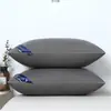 Un par de almohadas viene con una funda de almohada para dormir, núcleo de almohada de hotel, soporte para el cuello, uso doméstico, terciopelo de plumas para la siesta