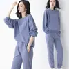 Traje casual de punto gofre estilo simple para mujer primavera otoño moda sudadera de manga larga cuello redondo bolsillo puño elástico pantalones de chándal dos piezas