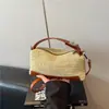 Bolsa de palha feminina de verão 2026 transfronteiriça, bolsa almofada, bolsa de ombro e transversal casual fashion para o dia a dia
