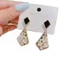 Pendientes de Diseño de Lujo Ligero Estilo Coreano Venta al por Mayor Nicho Versátiles Pendientes Colgantes de Flor de Trébol de Cuatro Hojas de Alta Gama para Mujer