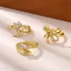 Anillo abierto de serpiente con lazo microincrustado de circonita, de lujo ligero europeo y americano, elegante y versátil, en stock para venta al por mayor