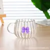 Vidrio resistente al calor simple de borosilicato taza linda de vientre grande con patrón vertical para el hogar moda simple taza de café taza de té con leche de calabaza