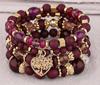Pulsera de borlas con colgante de amor hueco multicapa de estilo bohemio de venta caliente europeo y americano, juego de joyería multicapa con cuentas de vidrio
