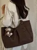 Bolso tote minimalista de estilo coreano con estampado de leopardo, nuevo para 2026, un bolso de hombro elegante y espacioso para el trabajo y los desplazamientos, también adecuado como bolso de axila