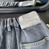 Nueva colección de otoño 2026: Ropa para niños y niñas, con estampados de letras de bigotes de gato, jeans tipo dad, jeans de pierna cónica y pantalones para niños, disponibles para venta al por mayor