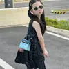 Nuevo bolso de mano de dibujos animados con cara sonriente para otoño e invierno, un mini bolso Kelly de alta gama con bloques de color, un bolso pequeño elegante y versátil para padres e hijos
