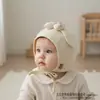 Nuevo Sombrero Protector de Orejas con Lazo 2026 Sombrero para Bebé Estilo Nuevo Primavera y Otoño Sombrero Protector de Orejas de Suéter para Niños y Niñas