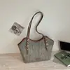Bolsa de Palha Tecida de Nicho Atacado para Mulheres Verão 2026 Novo Estilo Vazada Bolsa de Ombro de Luxo Leve Versátil Bolsa de Axila