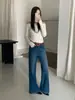 Jeans acampanados de otoño TOP estilo europeo de Guangzhou Trece Líneas vintage de alta resistencia con pliegues elásticos 360 grados con cinturón 61828