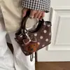 Bolso cubo de ante con lunares estilo coreano súper popular y versátil para mujer, nuevo modelo 2026, bolso de hombro y cruzado moderno y a la moda para el trabajo