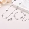 Nuevo juego de tres piezas de trébol de acero inoxidable transfronterizo: pulsera, collar y pendientes, cadena simple, accesorios versátiles de lujo ligero