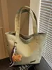 A Bolsa Sacola Casual e Simples Popular Deste Ano para Sala de Aula de Estudantes é uma Bolsa de Ombro Leve da Moda de Grande Capacidade Estilo Executivo para Mulheres