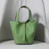 Versión mejorada de la primera capa de piel de vaca Togo Bolso tipo cubo para mujer con hebilla dorada para cesta de verduras Bolso de mano de cuero genuino Dorado