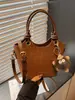 Bolso de mano tipo cubo de moda y único estilo coreano, estilo simple para el día a día, para mujer, bolso cruzado de diseño de nicho versátil casual