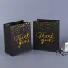 Bolsa de papel logo personalizado empresa ropa bolso de mano publicidad compras regalo de Navidad bolsas de embalaje fabricantes personalizado