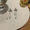 Nuevos pendientes de botón de plata S925 con forma de lazo para mujer, diseño de nicho de moda, clip para la oreja con cadena, joyería simple versátil, venta al por mayor