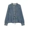 Atacado de roupas femininas transfronteiriças 2026 outono novo estilo europeu e americano camisa jeans com babados e cinto 126362004