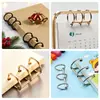 Anillo de tres agujeros de metal para calendarios de escritorio, clip de carpeta de hierro de tres anillos abrible, anillo de tres agujeros para calendario de escritorio en stock