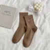 Outono e inverno novo cor sólida pequeno bordado de amor meias de cano básicas estilo acadêmico meias infantis versáteis estilo acadêmico meias femininas