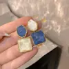 Aretes de venta caliente, minimalistas y chic, con un estilo fresco y discreto, elegante diseño geométrico, populares entre los influencers, aretes versátiles para venta al por mayor
