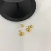 Pendientes Elegantes de Lujo Ligero Estilo INS Frío Colgantes Traseros Diseño Minimalista de Nicho Pendientes de Frijol Metálico Ovalados para Mujer