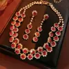 Aretes y Collar de Gota de Agua Incrustados con Diamantes Rojos de Año Nuevo, Accesorios Versátiles de Lujo Ligero de Nicho, Juego de Joyería de Alta Gama para Mujer al por Mayor