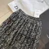Saia casual boêmia com estampa vintage de outono para mulheres, saia longa com cintura elástica, roupa feminina versátil, saia com barra ampla e fluida