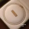 Fivela de anel de zircônia microincrustada de cobre Shijia Pérola corrente de clavícula simples forte luz design redondo temperamento celebridade da internet colar